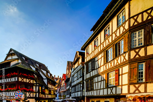 Classic colorized timber-framed alsacien houses in the street of