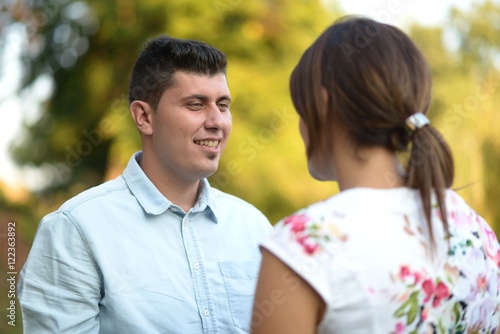 Work colleagues talking in office break outdoors