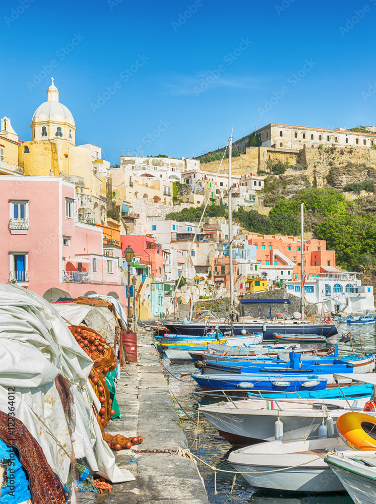 Marina in beautiful pastel colours on the island Procida in Italy.