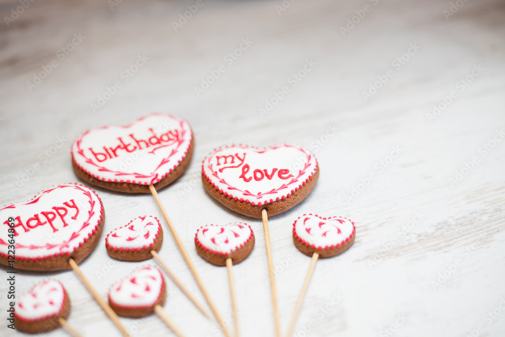 Funny and colorful gingerbread shapes on sticks.Happy Birthday