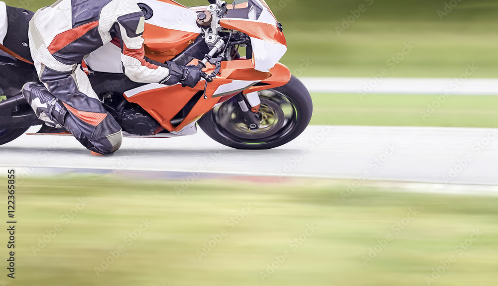 Motorcycle leaning into a fast corner on highway Motorcycle leaning into a fast corner on highway