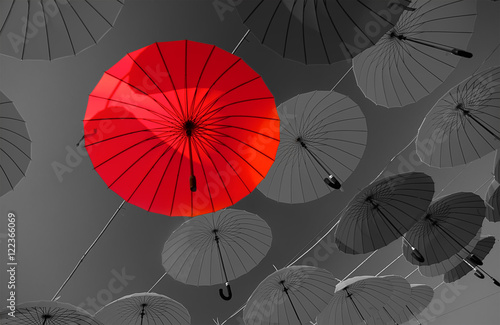 red and  black  white  umbrellas  under sky. abstract  background