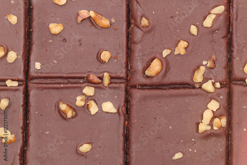 A Background of Chocolate Brownies with Nuts on Top