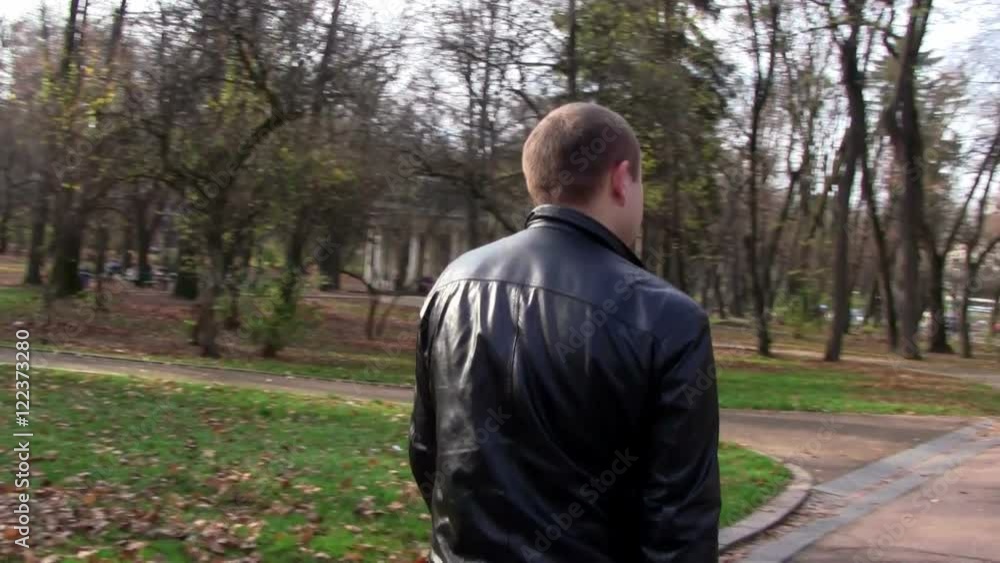 man coming autumn park/boy walking autumn park man coming autumn park/boy walking autumn park