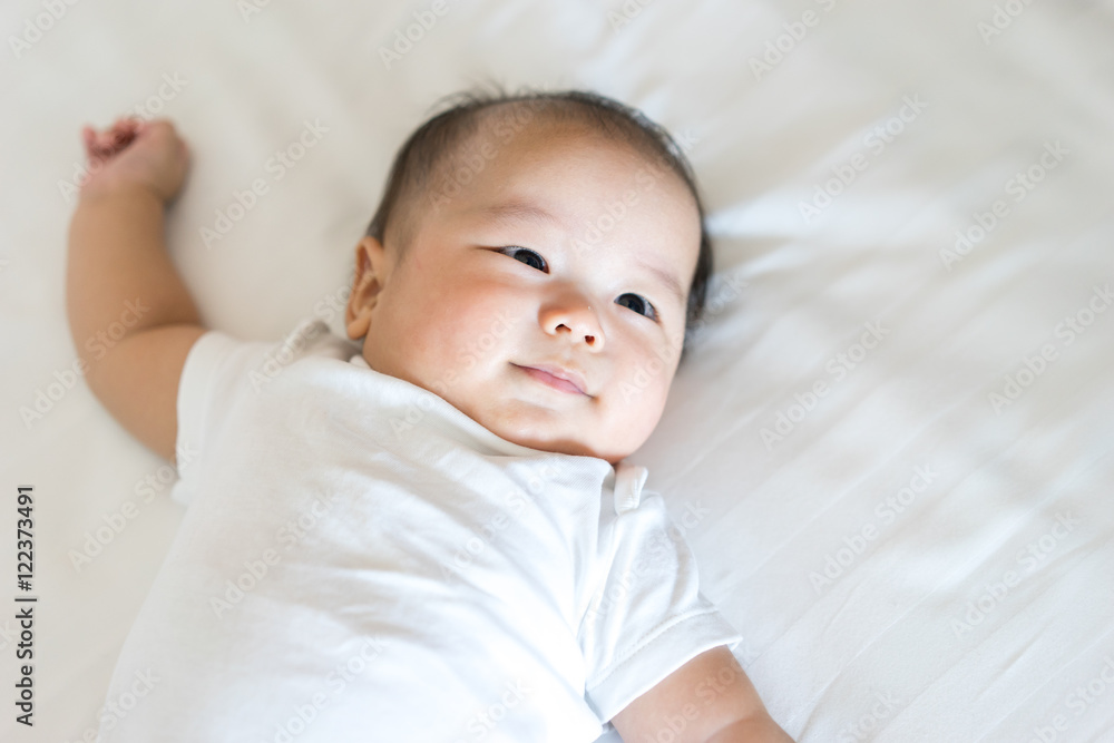 Portrait of a newborn Asian baby on the bed Portrait of a newborn Asian baby on the bed