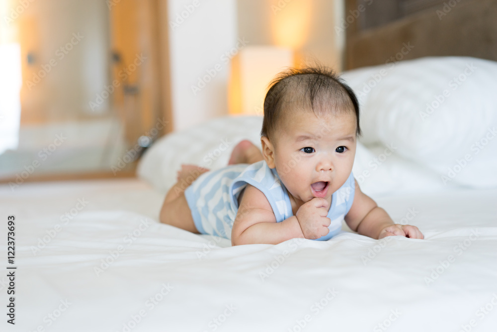 Portrait of a newborn Asian baby on the bed Portrait of a newborn Asian baby on the bed