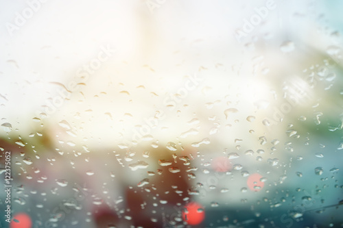 double exposure of blurred cityscape during traffic jam and raindrop ,abstract background