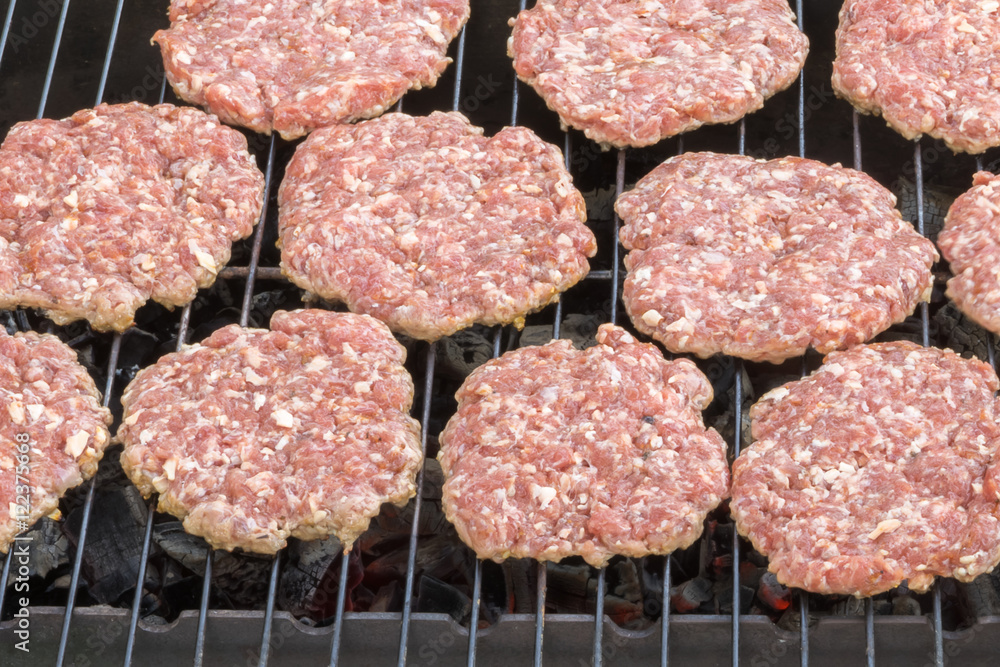 burgers hamburger fried on the grill over hot coals burgers hamburger fried on the grill over hot coals