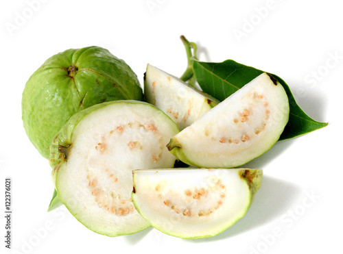 half and full of green guava (delicious tropical fruit) isolated on white 