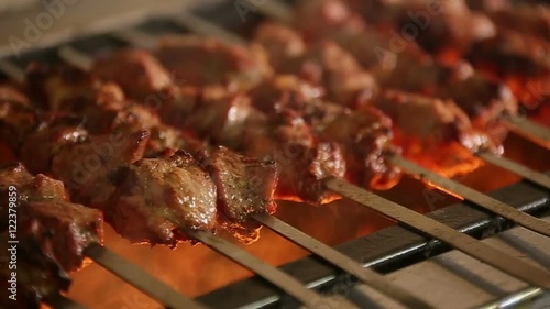 Cook roasts juicy kebab barbecue with crispy grilled slowmotion