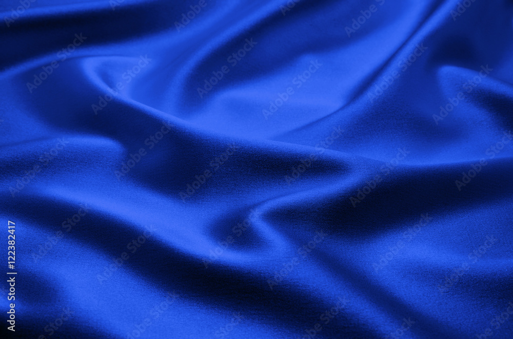 Smooth elegant blue silk can use as background Smooth elegant blue silk can use as background