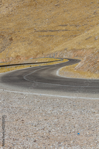 Curved road in Iraqi countryside located in Kurdistan region photo