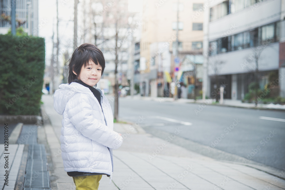 Asian child walking in the city Asian child walking in the city