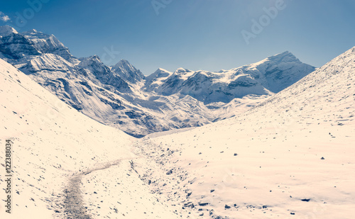 Snow covered winter landscape surrounding Thorong La pass. photo