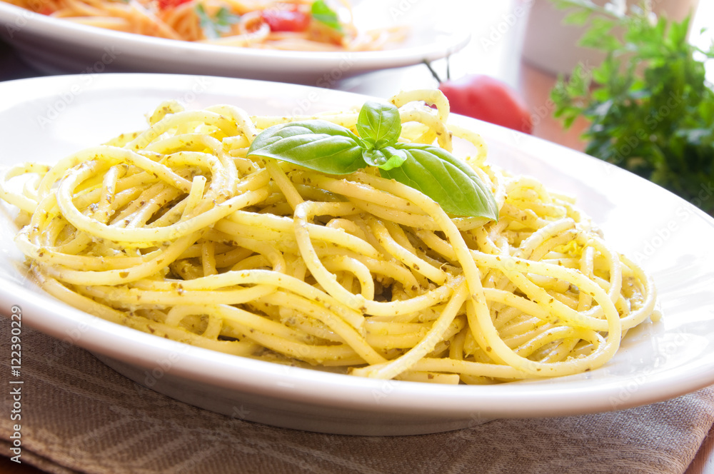 Spaghetti pasta with pesto sauce