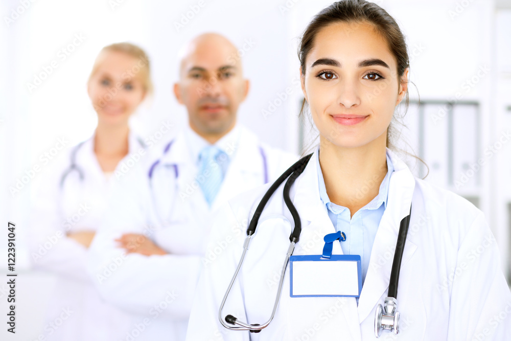 Happy doctor woman with medical staff at the hospital Happy doctor woman with medical staff at the hospital