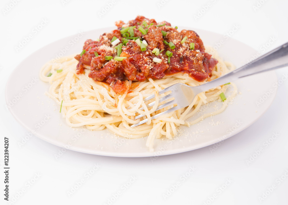 Spaghetti bolognese being eaten with a fork Spaghetti bolognese being eaten with a fork