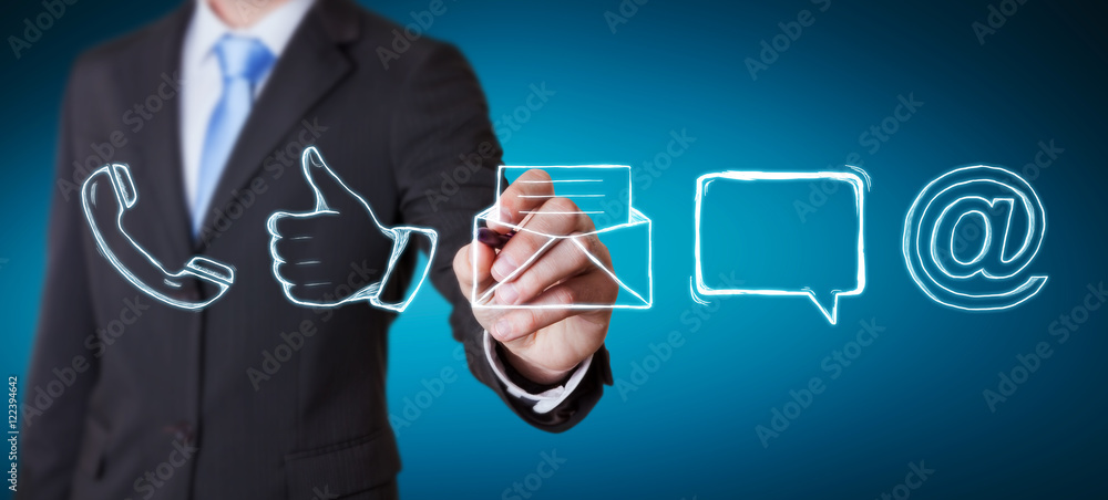 Businessman drawing manuscript contact icon with a pen Businessman drawing manuscript contact icon with a pen