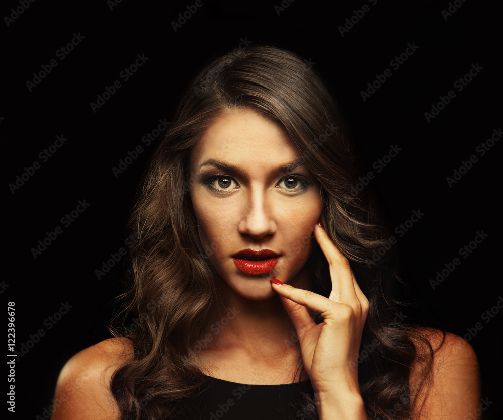 Beautiful young woman with make up and long wavy hair on black background Beautiful young woman with make up and long wavy hair on black background