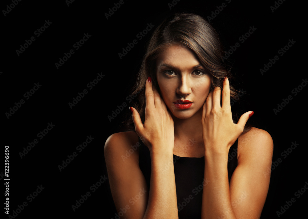 Beautiful young woman with make up and long wavy hair on black background Beautiful young woman with make up and long wavy hair on black background