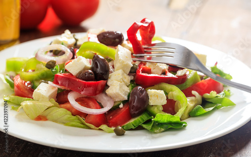 Greek salad on wooden background