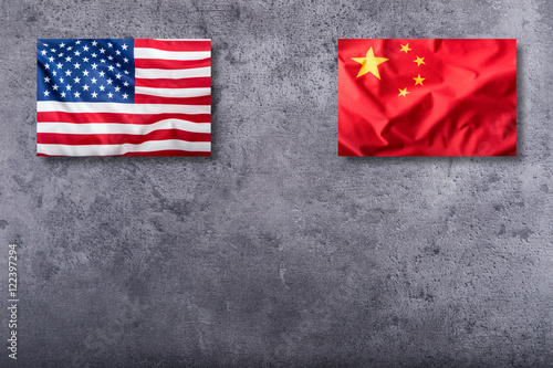 Photography Usa flag and china flag on concrete background-