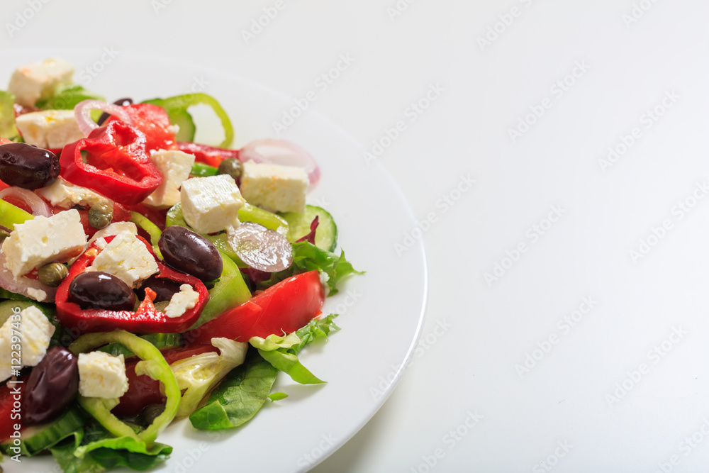 Greek salad on white background Greek salad on white background