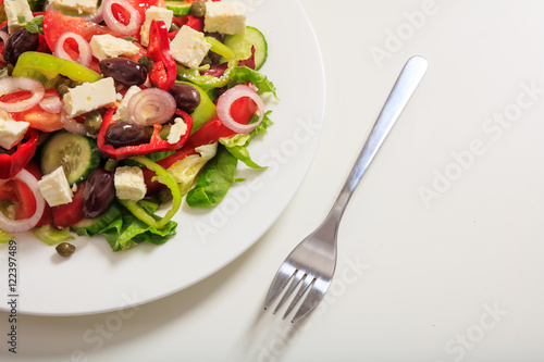 Greek salad on white background