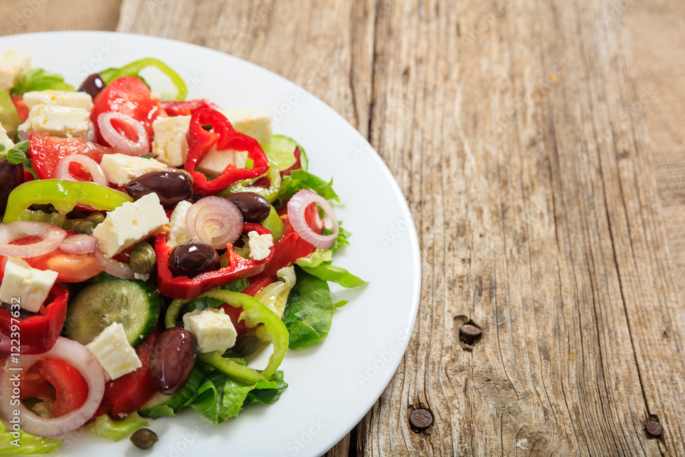 Greek salad on wooden background Greek salad on wooden background