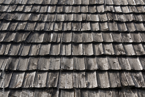 Weathered wooden tile roof texture.