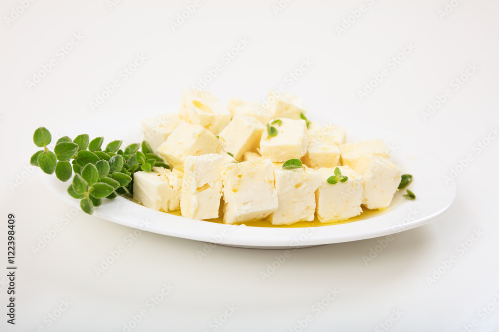 Feta cheece pieces on white background