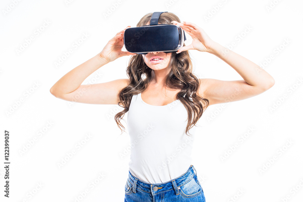 Young sexy girl with glasses of virtual reality in different poses isolated  on white background. Stock Photo | Adobe Stock