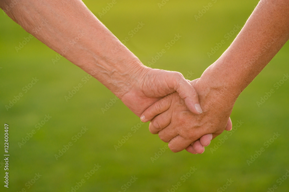 Hands of a senior couple. Two people holding hands. Devotion and trust. Together till the end. Hands of a senior couple. Two people holding hands. Devotion and trust. Together till the end.