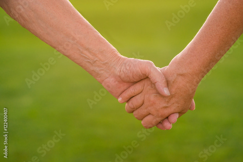 Hands of a senior couple. Two people holding hands. Devotion and trust. Together till the end.