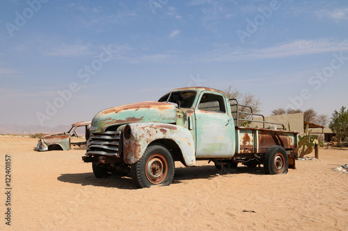 Old cars - wrecks in the african desert - oldtimer - autowracks - solitaire