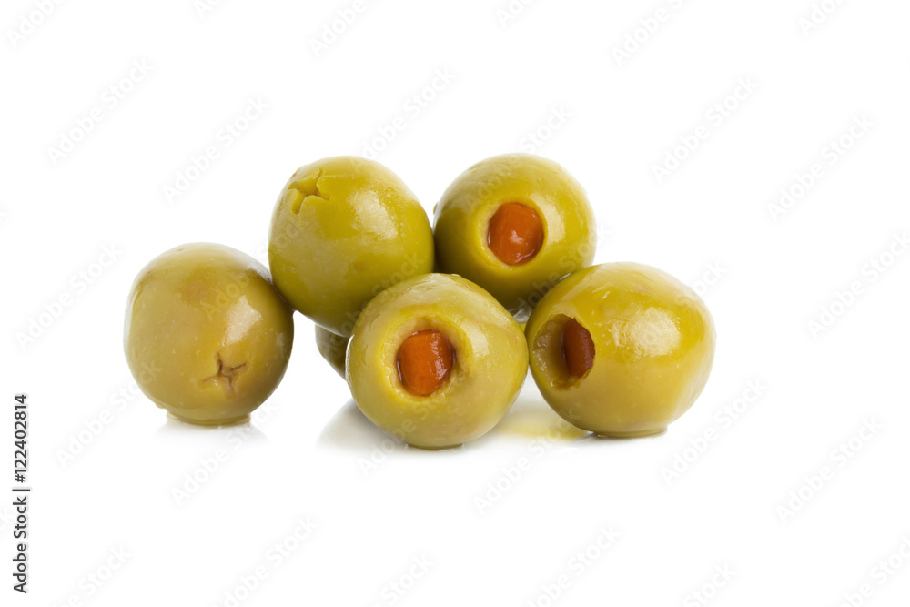 Obraz premium Green olives stuffed with red paprika isolated on white