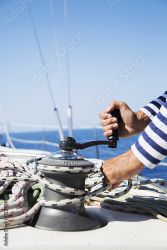 Man in action of pulling rope