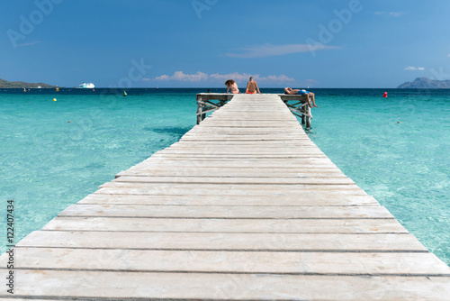 XXX - Wooden Jetty at the Mediterranean Sea with young people in the sun - 4140