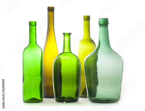 different colorful empty wine bottles family on white background