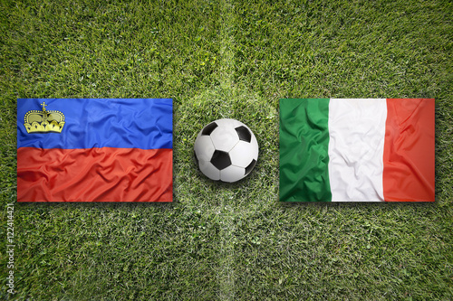 Liechtenstein vs. Italy flags on soccer field