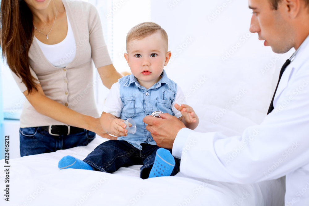 Little boy child  with his mother  at  health exam at doctor's office