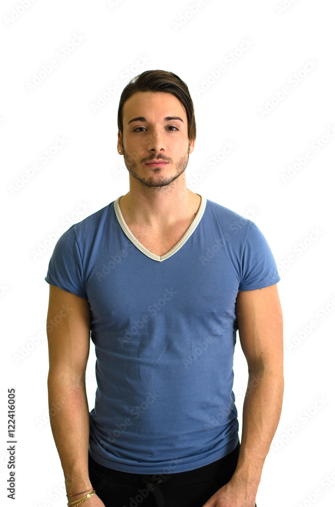 Attractive, muscular guy standing and looking in camera, isolated Attractive, muscular guy standing and looking in camera, isolated