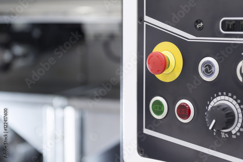 The emergency button or emergency knob of CNC milling machine with the control panel.
