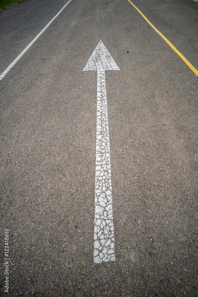 Arrow sign on the road