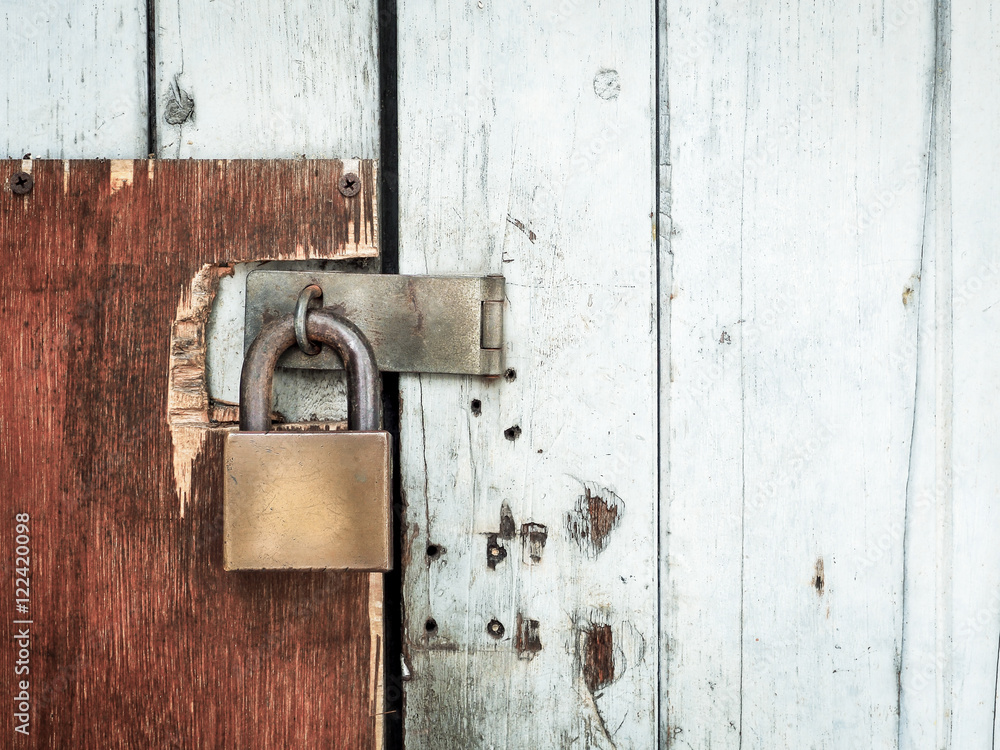 Old lock on a wooden door, With place your text (lock, rust, security) Old lock on a wooden door, With place your text (lock, rust, security)
