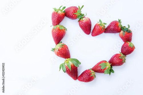 Strawberry on white background fruit's healthful cordial, useful