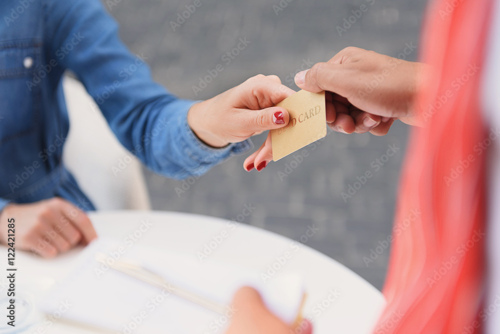 Customer paying by card in cafe
