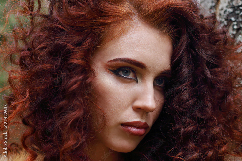Face of pretty woman with makeup and curly hair outdoor, close u Face of pretty woman with makeup and curly hair outdoor, close u