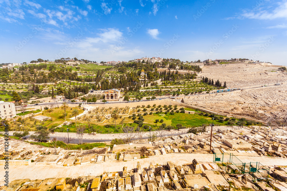 Mount of Olives and the old Jewish cemetery in Jerusalem, Israel. Gethsemane and Church of Mary Magdalene foreground.