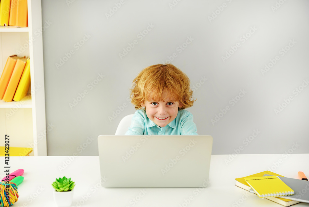 happy child sitting with computer happy child sitting with computer
